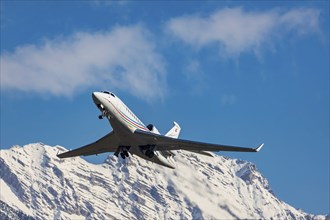 Aircraft of the airline Palmali Air taking off at Innsbruck Kranebitten Airport, Dassault Falcon 7X