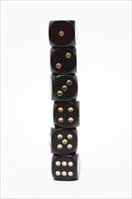 Symbol photo, stack of six black dice sorted by ascending value