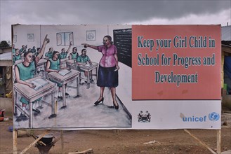 A sign calling on parents to send their children to school, Makeni, Bombali District, Sierra Leone,