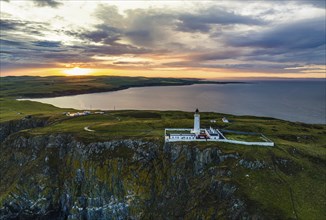 Sunset over Mull of Galloway Lighthouse from a drone, Mainland Scotland, Scotland, UK