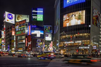 Taxi at the Shibuya intersection, most frequented intersection in the world, Shibuya, Tokyo, Japan,