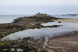 Fort National at low tide on a tidal island off Saint-Malo, Ille-et-Vilaine, Brittany, France,