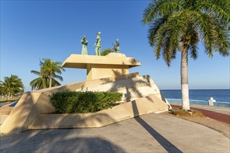 Artwork sculpture of priest with Spanish soldier and Mayan person, Malecon, Campeche city, Campeche