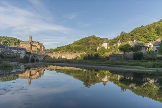 Medieval bridge over Lot with castle in village of Estaing. Aveyron, France, Europe