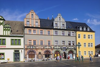 The square was given its distinctive shape in the 16th century by the town house and the