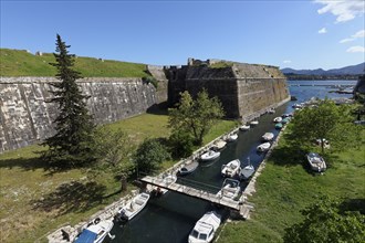 Old Venetian fortress, Martinengo bastion and moat with fishing boats, Corfu Town, Kerkira or