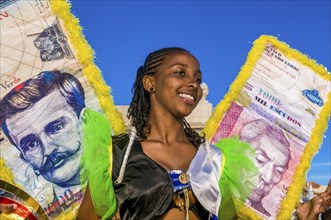 Colourful costumed, pretty women are dancing. Carnival. Mindelo. Cabo Verde. Africa