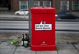 Talking red dustbin I am a dirt queen, campaign by Stadtreinigung Hamburg for more cleanliness,