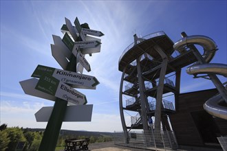 World signpost, Noah's Sails lookout tower on Ellenbogen, 813 m. high mountain in the Rhön in the