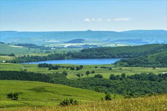 View on Chauvet Lake, Regional Nature Park of the Volcanoes of Auvergne, Puy de Dome department,