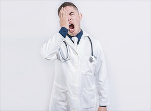 Sleepy doctor yawning on isolated background. Tired of working doctor concept, Tired and sleepy