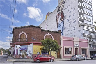 Giant wall painting on apartment's side and graffiti artwork in the city San Salvador de Jujuy,