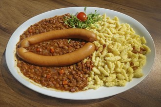 Swabian cuisine, lentils and spaetzle with string sausages, wienerle, veal sausages, pasta, typical