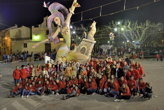 "La Font" Fallas group in front of a Falla, a papier-mâché figure, at the Falles or Fallas spring