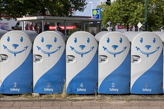 Bicycle boxes at a bus and tram stop in Essen, commuters can rent the boxes and park their bikes