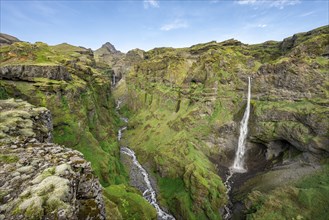 Mountain landscape with canyon, Hangandifoss waterfall in Múlagljúfur Canyon, Sudurland, Iceland,