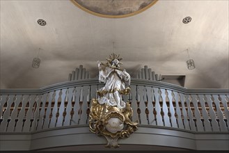 Figure of St. Nepomuk in front of the organ loft in the parish church of St. James the Elder, built