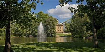 Fountain in the pond, Warmer Damm Landscape Park with Hessian State Theatre, Wiesbaden, Hesse,