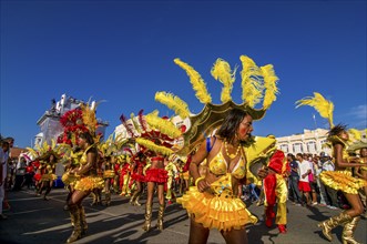 Colourful costumed, pretty women are dancing. Carnival. Mindelo. Cabo Verde. Africa