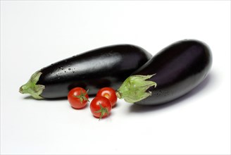 Egg plants (Solanum melongena) and cherry tomatoes