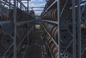 Shelf storage with sorted car rims at a scrap yard, Bavaria, Germany, Europe