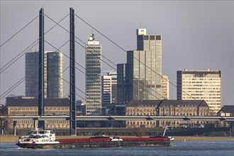 Düsseldorf, city centre skyline, skyscrapers, Rheinkniebrücke, Rhine, cargo ship