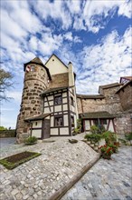 Tower and half-timbered house, Burgamtmannsgebäude der Burggrafenburg, Kaiserburg, in autumn,