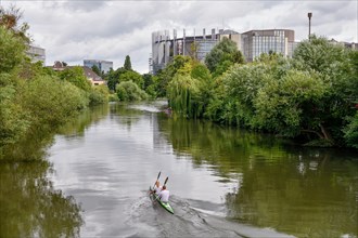 Kayak on the Ill, in the background the building of the European Parliament, Strasbourg,