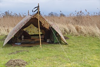 Campsite of a nature photographer on the river Trebel, people out in nature, Peene Valley River