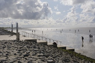 Tourists in the mudflats, promenade on the beach, Norddeich, Norden, North Sea, East Frisia, Lower