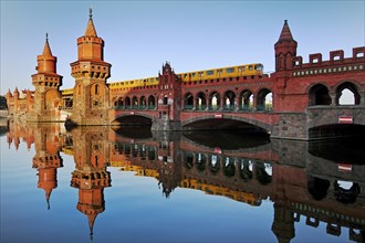 Oberbaum Bridge over the Spree with yellow underground, Friedrichshain-Kreuzberg district, Berlin,