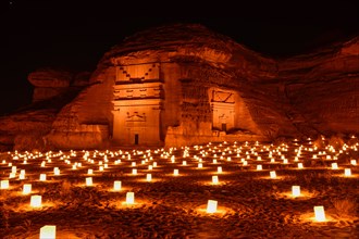 Illuminated Nabataean tombs at night, Hegra or Mada'in Salih, AlUla region, Medina province, Saudi