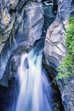 Waterfall in a canyon between the rock faces, Jasper National Park, Canada, North America