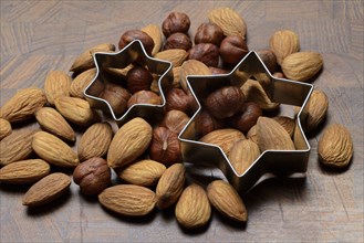 Nuts and cookie cutters, almonds and hazelnuts