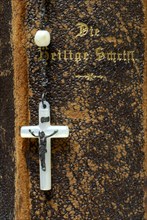 Cross of the rosary on bible, crucifix, holy scripture, book