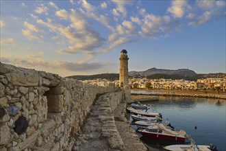 Morning light, sunrise, Venetian harbour, harbour wall, Venetian lighthouse, boats, blue sky, few