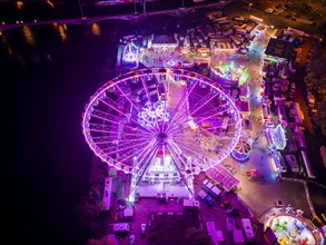 A 55m high illuminated Ferris wheel is the landmark of the fair at the Volksfest grounds on