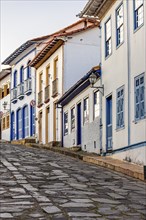 Slope with stone pavement and colonial houses in the city of Diamantina, state of Minas Gerais,