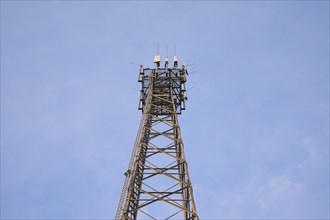 Mobile phone mast, transmission mast in front of sky, Hesse, Germany, Europe