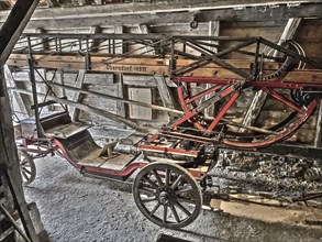 Old style slightly alienated photo of Historic fire engine for horse-drawn carriage from early 20th