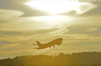 Airbus of the airline Swiss International Air Lines after take-off in climbing departure against