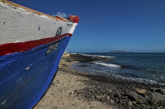 Wooden boat with writings at sandbeach. San Vincente. Cabo Verde. Africa