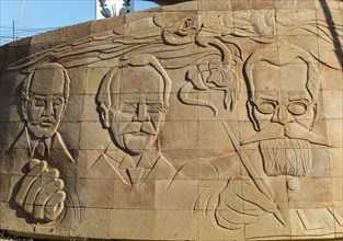 Faces of historic figures Independence monument in Barrio San Roman, Campeche city, Campeche State,