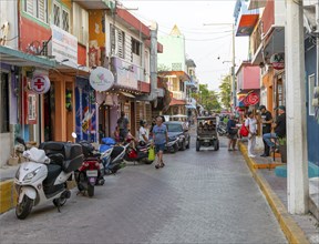 Golf cart vehicles in narrow street, Isla Mujeres, Caribbean Coast, Cancun, Quintana Roo, Mexico,