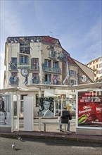 Bus stop and wall painting Cinéma Cannes about movie stars in the city Cannes, French Riviera,