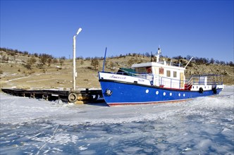 Boat stuck by the ice, Lake Baikal, Olkhon Island, Pribaikalsky National Park, Irkutsk Province,