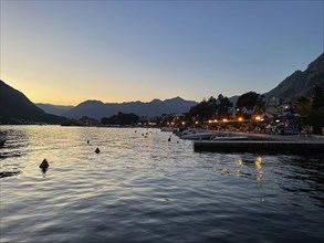 Evening atmosphere on the beach promenade of Kotor, Bay of Kotor, Adriatic Sea, Mediterranean Sea,