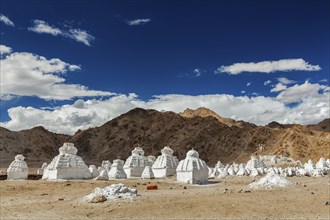 Whitewashed chortens (Tibetan Buddhist stupas) . Ladakh, Jammu and Kashmir, India, Asia