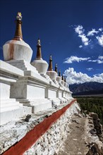 Chortens (Buddhist stupas) outside the Shey palace, Ladakh, India, Asia