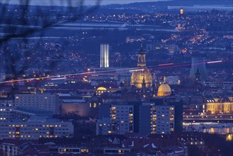 View of the old town from the Dresdner Heide in the evening: a rescue helicopter approaching the